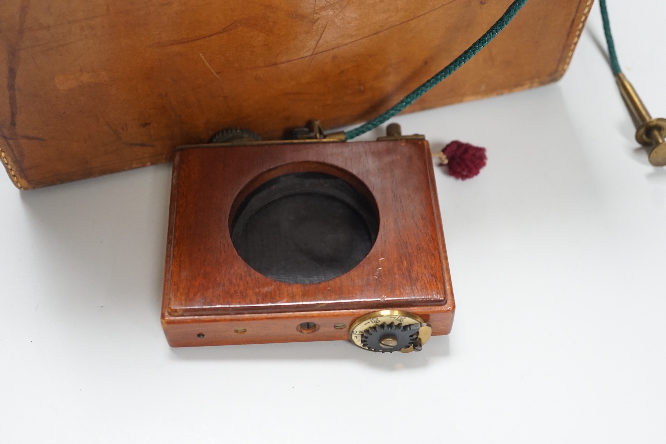 A leather cased Army & Navy auxiliary mahogany and brass folding camera, Newton & Co. Lens